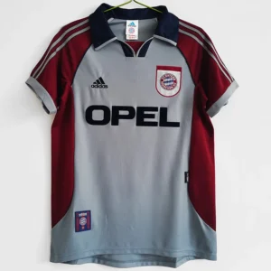 Bayern Munich 1998/99 Retro Away Jersey Fan Version - Front View Bayern Munich away jersey: light gray body with maroon sleeves, navy collar, Adidas logo, Bayern crest, and Opel sponsor across the chest.