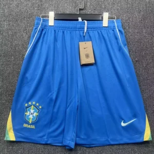 Brazil 2026/27 Home Shorts - Front View Blue Brazil national team shorts with CBF emblem on the left leg, Nike swoosh on the right, and yellow-green side panels with a tag attached.