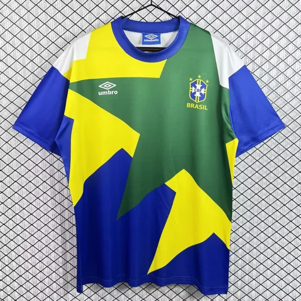 Brazil national football jersey on a hanger with green, yellow, and blue geometric panels and the CBF crest on the chest
