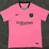 Barcelona 2020/21 Third Jersey Fan Version - Front View Bright pink FC Barcelona football jersey with black Nike swoosh, club crest, and Rakuten sponsor across the chest.