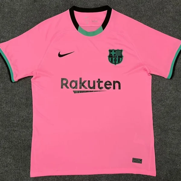 Barcelona 2020/21 Third Jersey Fan Version - Front View Bright pink FC Barcelona football jersey with black Nike swoosh, club crest, and Rakuten sponsor across the chest.