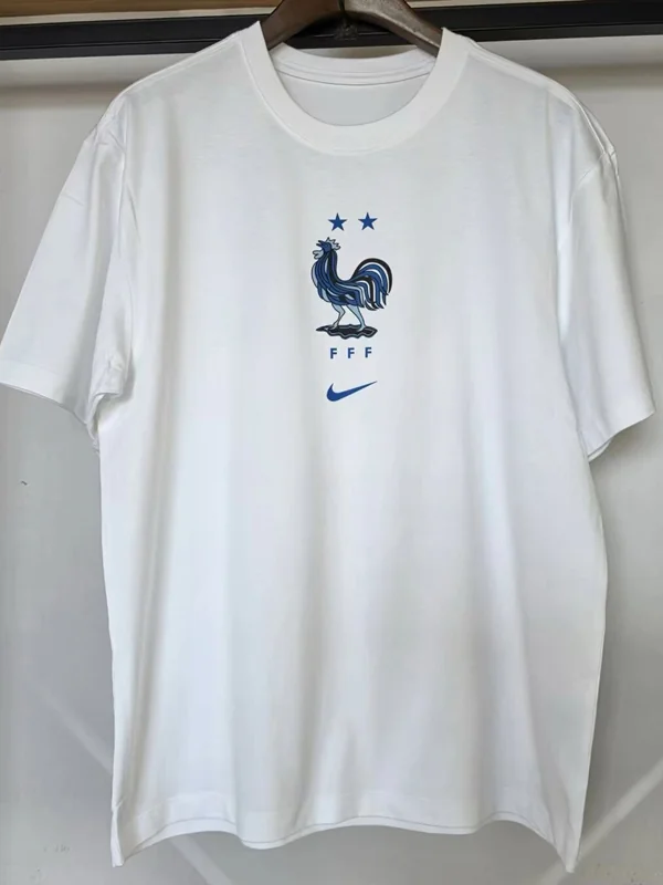France 2026/27 White T-Shirt - Front View - KFCool – Football Jerseys & Soccer Kits Store White T-shirt with blue French Football Federation crest (rooster), two stars above, and a Nike swoosh below.