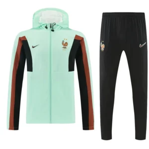 France 2026/27 Windbreaker Suit - Front View Mint green France national football team tracksuit jacket with brown and black color blocks, shown with matching black pants bearing the crest and Nike logos.