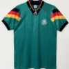 Germany national football team away jersey in teal green, with Adidas logo and crest on the chest, hanging on a hanger.