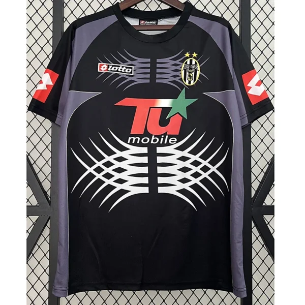 Juventus 2001/02 Retro Goalkeeper Jersey Fan Version - Front View Juventus football jersey on a hanger: black with purple sleeves, large white geometric chest design and T-Mobile sponsor.
