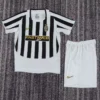 Juventus 2003/04 Retro Home Kids Kit Fan Version - Front View - KFCool – Football Jerseys & Soccer Kits Store Juventus black-and-white striped soccer jersey with sponsor logo and crest, paired with white shorts featuring a gold Nike swoosh.