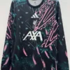 Liverpool FC training jersey on a hanger, black with pink/teal abstract pattern, featuring Adidas, LFC crest, and AXA sponsor.