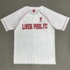 Liverpool FC white home jersey with red pinstripes and crest on the chest, front view