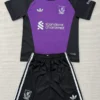 Purple and black soccer jersey with matching black shorts; features sponsor text 'standard chartered' and a club crest on the left chest, plus Adidas stripes on shoulders and shorts.