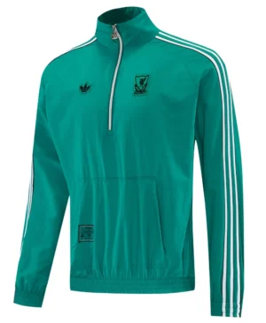 Liverpool 2026/27 Green Windbreaker - Front View Teal Adidas track jacket with white stripes on sleeves, half-zip collar, and front pocket; features club crest on chest and small Adidas logo.