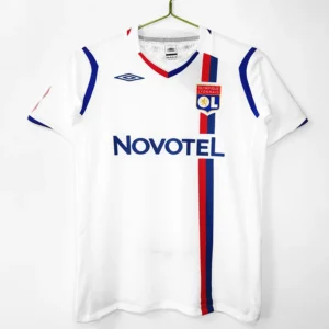 Lyon 2008/09 Retro Home Jersey Fan Version - Front View White Olympique Lyonnais football jersey on a hanger with blue and red vertical stripes, sponsor 'NOVOTEL' displayed, crest and Umbro logo visible.