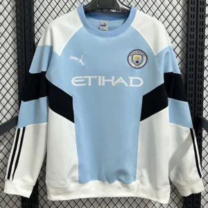 Manchester City 2026/27 Blue White Hoody - Front View Manchester City football jersey in light blue and white with Etihad sponsor, Puma logo, and team crest.