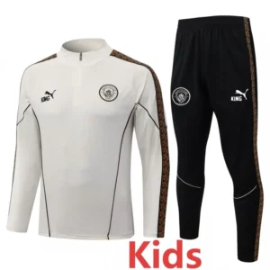 Kids' Manchester City training tracksuit: white top with crest and black pants with sidestrip detail and matching branding.