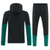 Black tracksuit set: hooded jacket with teal sleeve panels and matching black pants with teal lower sections.