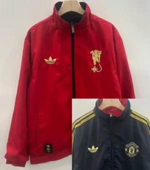 Red zip-up jacket with gold crest on left chest and Adidas trefoil on the right, hanging on a wooden hanger.