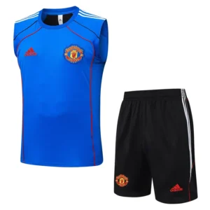 Manchester United 2025/26 Blue Sleeveless Shorts - Front View Manchester United blue training jersey with crest and red Adidas logo, shown with black shorts featuring the club crest and white stripes.