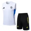 Manchester United training kit: white sleeveless jersey with blue side panel and black shorts with neon yellow stripes.