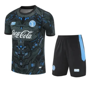 Black football jersey with blue circuitry pattern, Coca-Cola sponsor, and Napoli crest, paired with black shorts with a blue side panel.