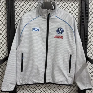 Gray zip-up jacket on a hanger with blue piping, featuring EA7, Napoli crest, and Coca-Cola branding.