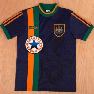 Newcastle United 1997/98 Retro Away Jersey Fan Version - Front View Navy blue Adidas soccer jersey with orange and green vertical stripes, crest on the chest, and a Newcastle Brown Ale round logo an orange ring.