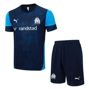 Marseille 2025/26 Royal Blue Training Short Suit - Front View Olympique de Marseille training kit: navy jersey with light-blue sleeves, Randstad sponsor, Puma logo, and club crest; matching navy shorts with crest.