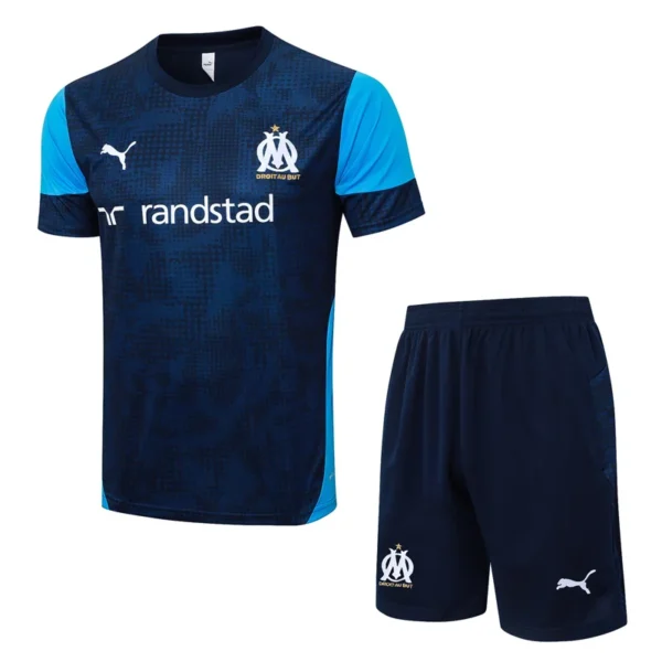 Olympique de Marseille training kit: navy jersey with light-blue sleeves, Randstad sponsor, Puma logo, and club crest; matching navy shorts with crest.