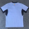 Marseille 2026/27 Third Jersey Fan Version - Back View Back view of a light blue athletic jersey with dark navy side panels and black cuffs, shield emblem near the collar.
