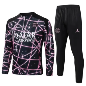PSG 2025/26 Black Purple Half Pull Tracksuit - Front View PSG training tracksuit: black with pink neon web pattern, front says 'QATAR AIRWAYS' and team crest on chest; matching black pants with PSG crest and Jordan logo.