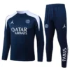 Paris Saint-Germain navy training jacket and joggers with white shoulder panels and sponsor logos (Qatar Airways) and PSG crest, full tracksuit set.