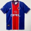 PSG 1995/96 Retro Home Jersey Fan Version - Front View Blue soccer jersey with a central red stripe and white trim, featuring Opel sponsor logo and Nike swoosh.