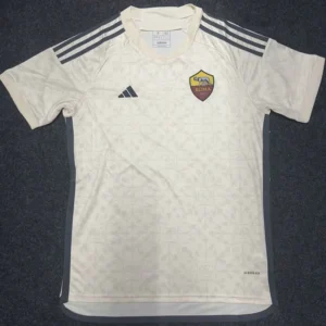 Roma 2023/24 Away Jersey Fan Version - Front View White AS Roma football jersey with dark side panels, three black stripes on shoulders, and club crest on the chest laid flat.