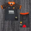 Roma 1999/00 Retro Away Kids Kit Fan Version - Front View - KFCool – Football Jerseys & Soccer Kits Store Adult-sized football kit laid flat: black pinstripe jersey with orange collar and cuffs, sponsor text 'INA Assitalia', and a crest; matching black shorts with an orange waistband and a red arc design.