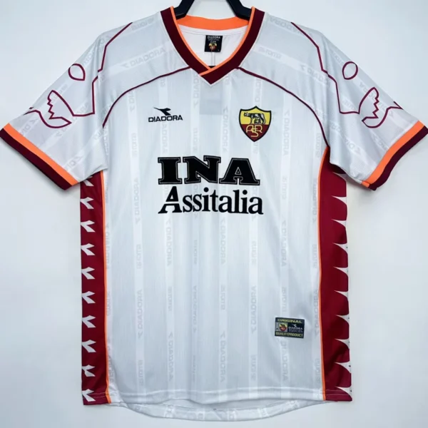 Roma 1999/00 Retro Away Jersey Fan Version - Front View White Diadora soccer jersey with orange trim, maroon side panels, and a club crest on the chest.