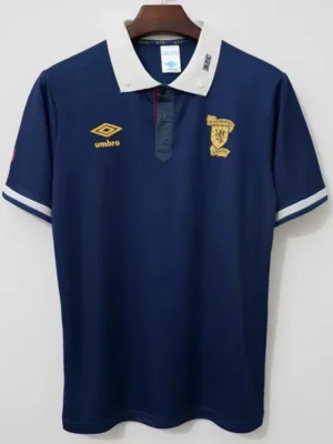 Scotland 1989/91 Retro Home Jersey Fan Version - Front View Navy polo shirt with a white collar on a hanger; yellow Umbro logo on the left chest and a gold crest emblem on the right chest, white stripe accents on sleeves.